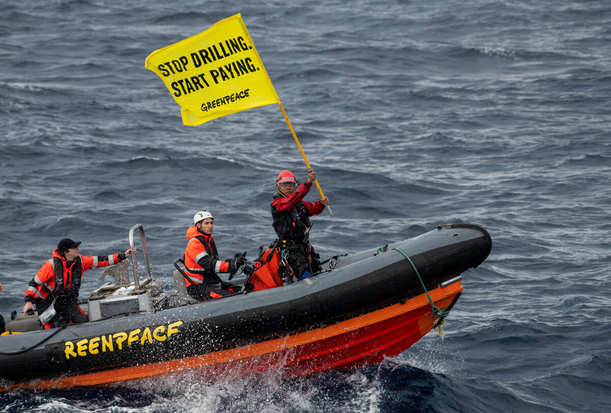 Greenpeace climate justice activists approach and board Shell platform en route to major oilfield with message: ‘STOP DRILLING. START PAYING.’
